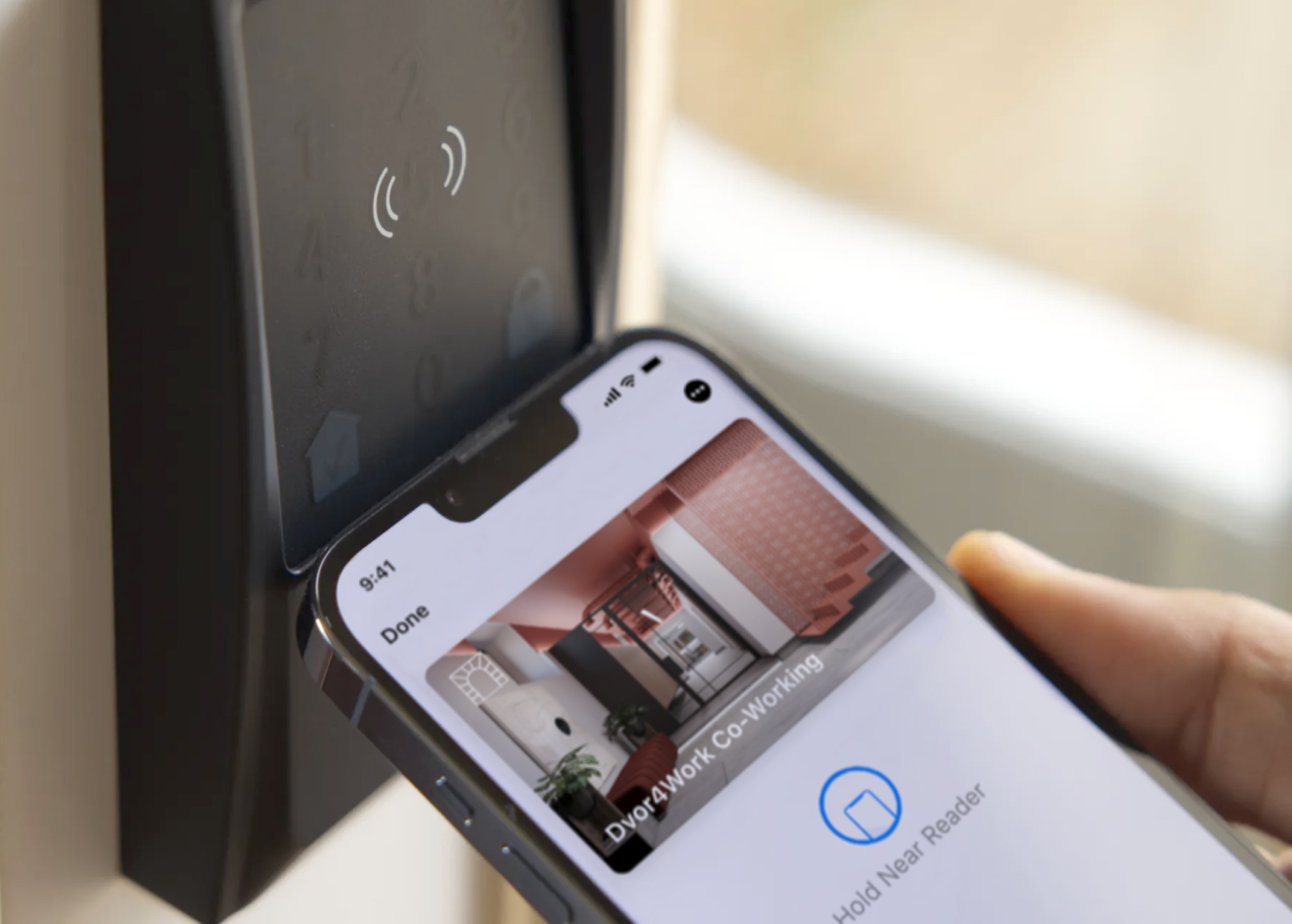 Dvor4Work mobile wallet pass held near an NFC door reader